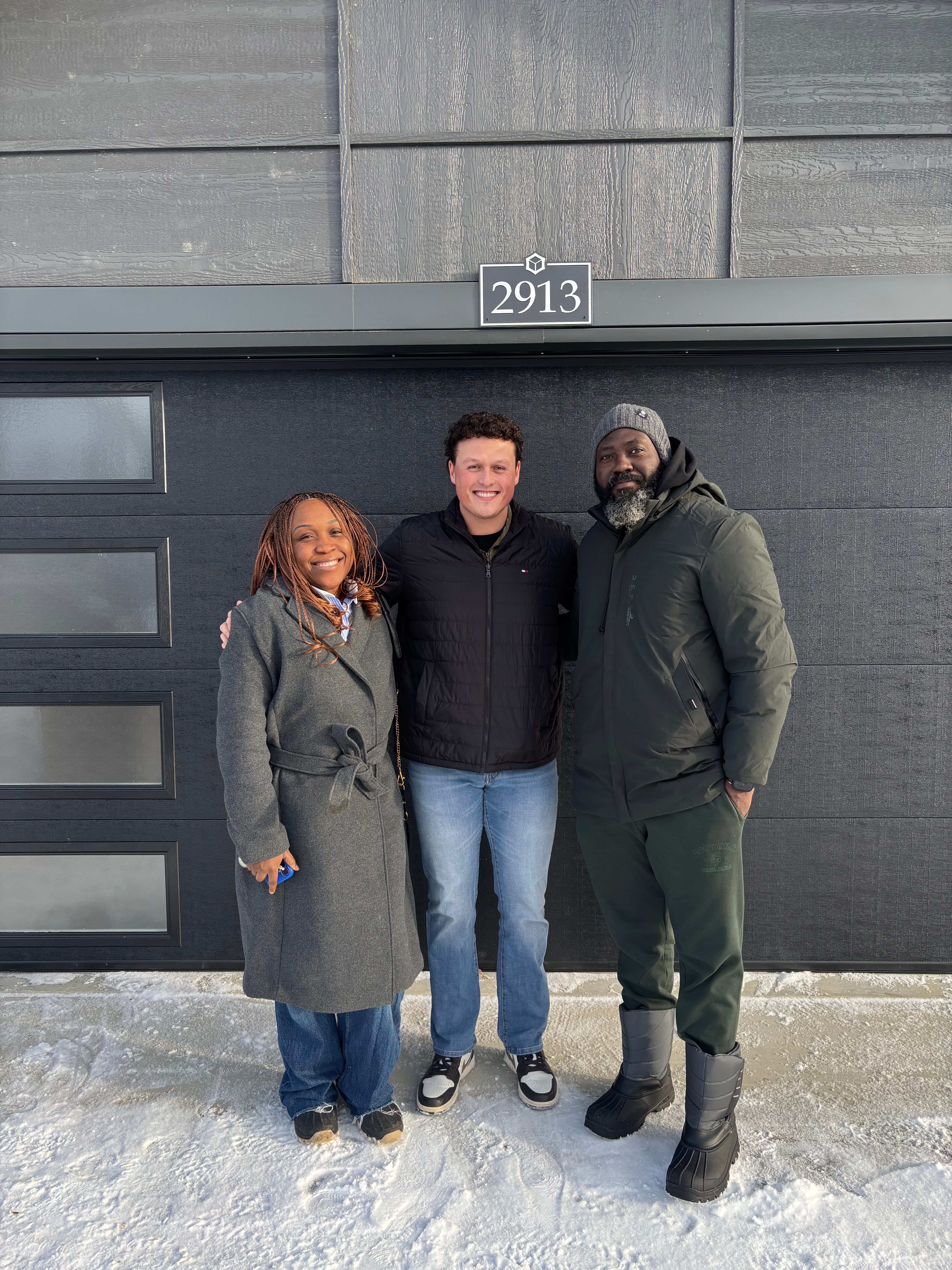 Talon Frick with clients at their new home — 2913, winter possession day Regina