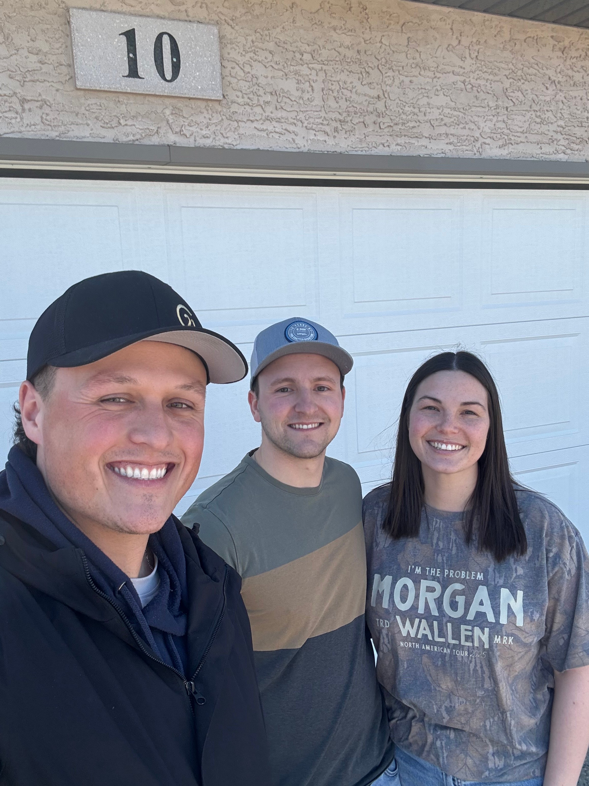 Talon Frick with clients at their new home — possession day
