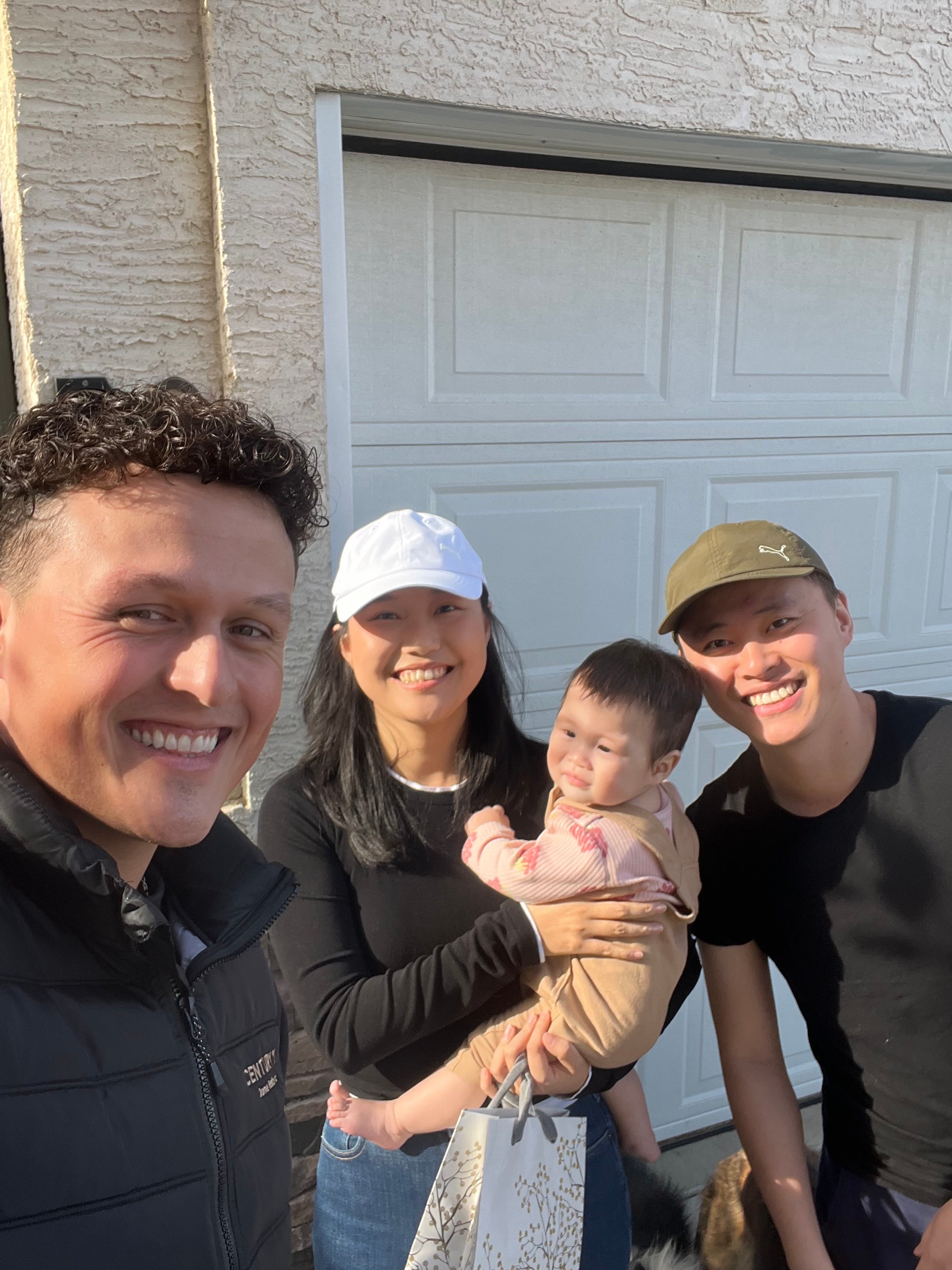 Talon Frick with young family on possession day — new home Regina