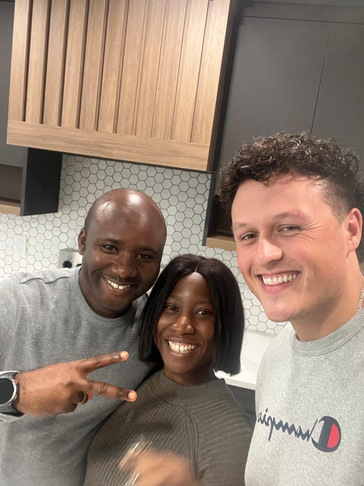 Talon Frick celebrating with clients in their new home — possession day